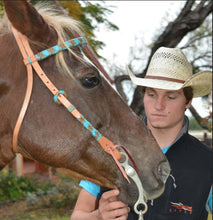 Load image into Gallery viewer, 2030-TN Harness Leather Headstall featuring natural and turquoise braiding, braided loops, and tassels for a stylish, durable design.
