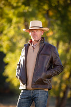 Load image into Gallery viewer, Houston Concealed Carry Jacket in antique brown with premium goat leather, two holsters, and magazine pockets for secure storage.