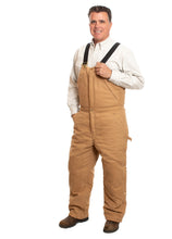 Load image into Gallery viewer, Made with 12 oz canvas and quilted polyester lining, these Canvas Bib Overalls feature adjustable suspenders and multiple pockets for all your gear.