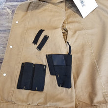 Load image into Gallery viewer, Chisum Canvas Jacket featuring hidden holsters, adjustable cuffs, and magazine holders for concealed carry.
