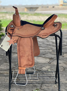 Diamond Back 15.5" Alamo Air Barrel saddle with wood fiber glass-covered tree, locking Blevins, and chocolate suede seat.