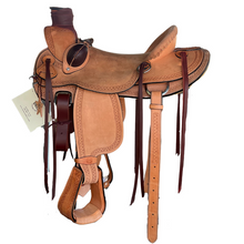 Load image into Gallery viewer, 16&quot; 58 Wade saddle with full double rigging, rough-out golden leather, and Wyoming tooling for a classic look.