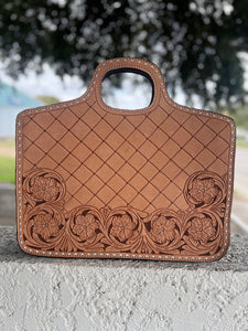 Stylish #6 Traveling Cowboy Copper briefcase with hand tooling, Buckstitch accents, and a versatile removable strap for easy carrying.