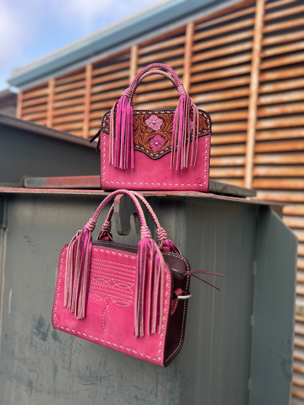 Handcrafted Bronco Bag - Pink Cowboy Stitch with floral/geo tooling, D-ring for strap, and card slot inside.