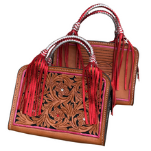 Load image into Gallery viewer, Handcrafted Leave Him on Red Bronco Bag in golden leather with floral tooling and red, silver crystals.