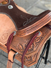 Load image into Gallery viewer, Durable Ranchy Roper Saddle with leather roughout floral tooling, nylon tie straps, and breastcollar dees.