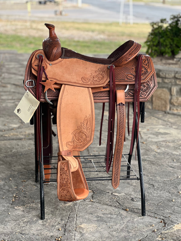 The Ranchy Roper Saddle features golden roughout leather, a 16