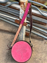 Load image into Gallery viewer, The Cowboy Stitch Canteen Bag in pink with floral tooling, removable strap, and Buckstitch details, perfect for everyday use.