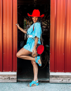 Handcrafted Cowboy Stitch Canteen Bag in red with floral and geometric tooling, removable strap, and Buckstitch accents.