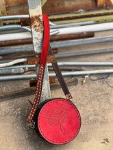 Load image into Gallery viewer, The Cowboy Stitch Canteen Bag in red with floral tooling, removable strap, and Buckstitch details for everyday use.