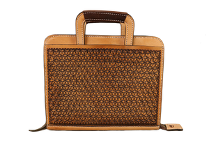 Cowboy Briefcase in golden and chocolate leather with intricate snowflake tooling for a stylish look.