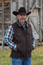 Load image into Gallery viewer, Oilskin Concealed Carry Vest made from water-resistant waxed canvas, featuring hidden holsters and adjustable straps.