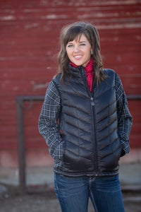 Women's McKinley Down Vest - Front View showcasing the 180 down fill, down-proof polyester shell, hip-length hem, and sleek angled stitching.